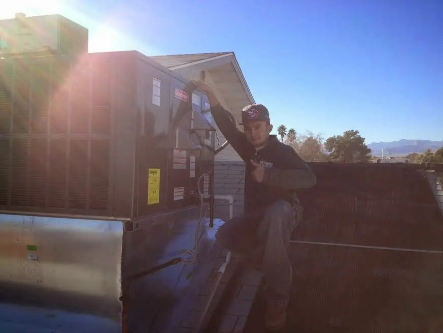 HVAC technician performing HVAC Inspection on a rooftop unit in Chanceford